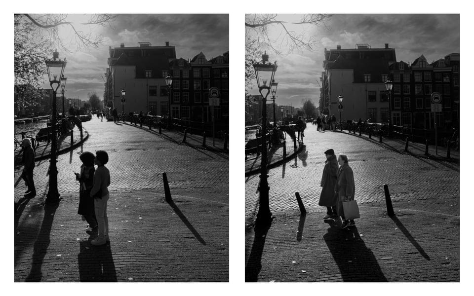 two people walking down a street