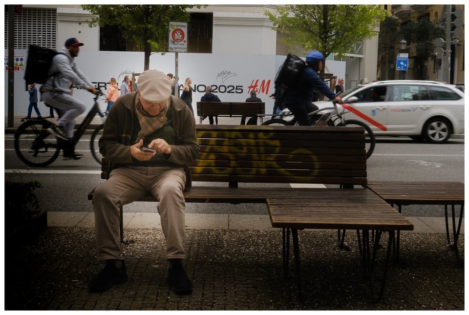 a man sitting on a bench