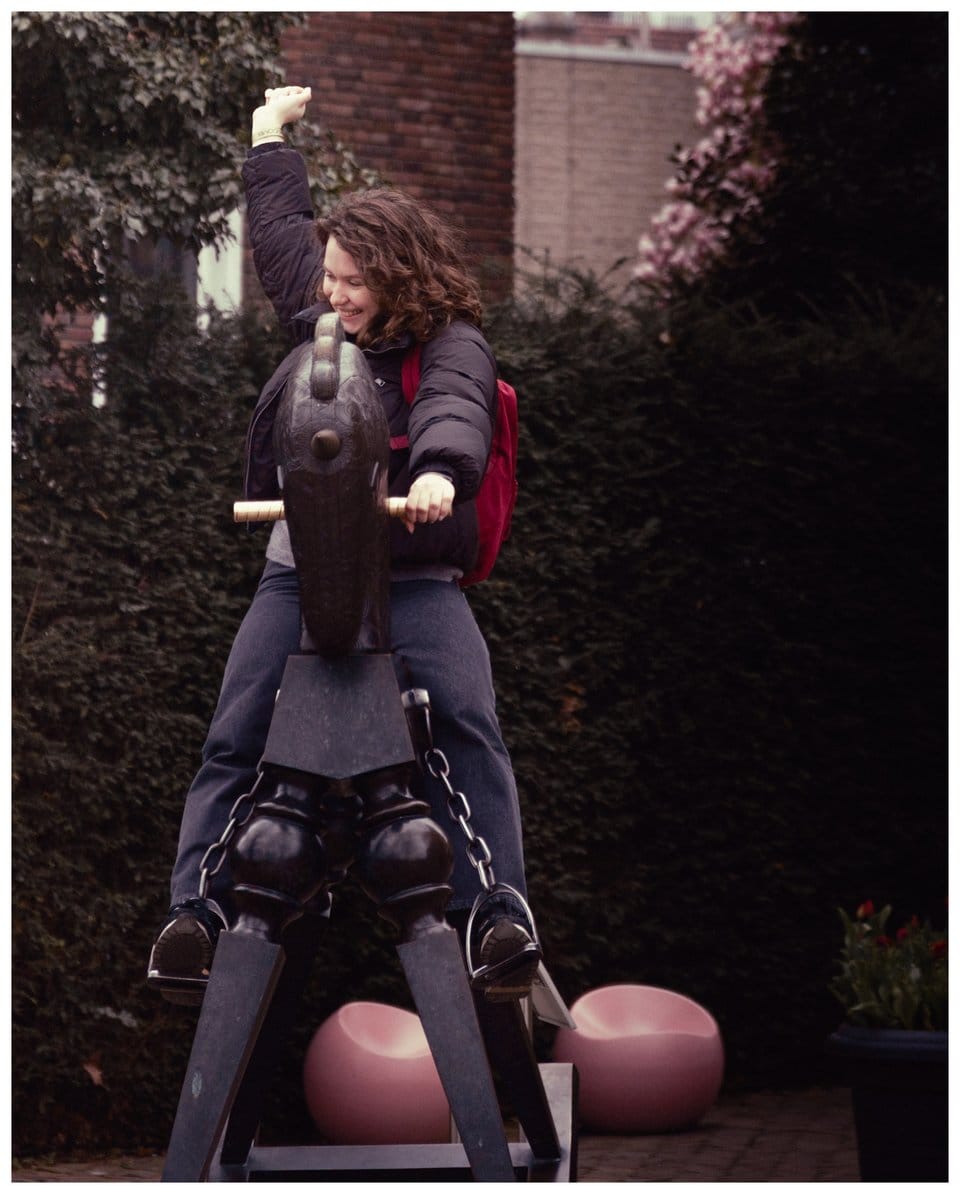 a woman riding a horse