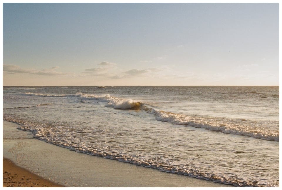 A beach and a wave breaking